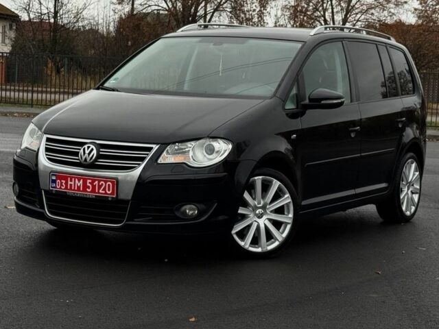 Черный Фольксваген Туран, объемом двигателя 2 л и пробегом 260 тыс. км за 9950 $, фото 1 на Automoto.ua