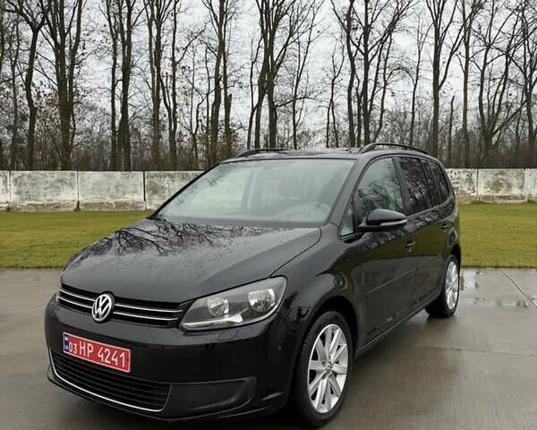 Черный Фольксваген Туран, объемом двигателя 1.4 л и пробегом 201 тыс. км за 7800 $, фото 1 на Automoto.ua