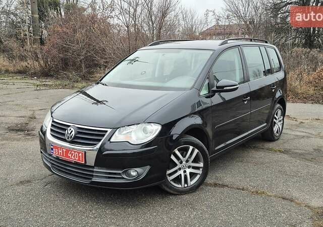 Чорний Фольксваген Туран, об'ємом двигуна 1.4 л та пробігом 248 тис. км за 7699 $, фото 1 на Automoto.ua