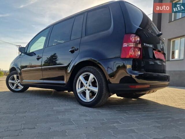 Черный Фольксваген Туран, объемом двигателя 1.4 л и пробегом 197 тыс. км за 8600 $, фото 1 на Automoto.ua