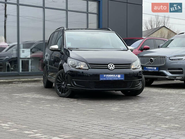 Черный Фольксваген Туран, объемом двигателя 1.4 л и пробегом 235 тыс. км за 8990 $, фото 1 на Automoto.ua