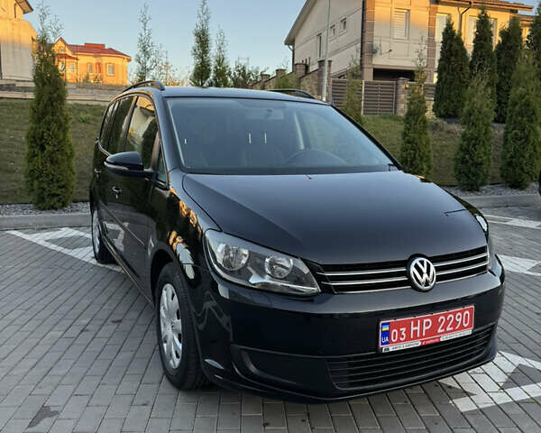 Черный Фольксваген Туран, объемом двигателя 1.6 л и пробегом 185 тыс. км за 11300 $, фото 1 на Automoto.ua
