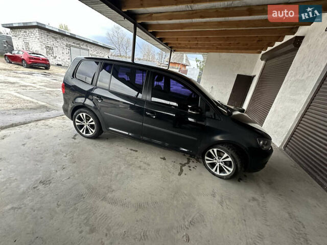 Черный Фольксваген Туран, объемом двигателя 1.4 л и пробегом 170 тыс. км за 7300 $, фото 1 на Automoto.ua