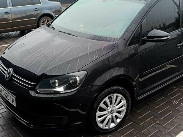 Черный Фольксваген Туран, объемом двигателя 1.4 л и пробегом 200 тыс. км за 10500 $, фото 1 на Automoto.ua