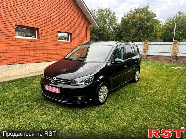 Черный Фольксваген Туран, объемом двигателя 1.6 л и пробегом 248 тыс. км за 9800 $, фото 1 на Automoto.ua