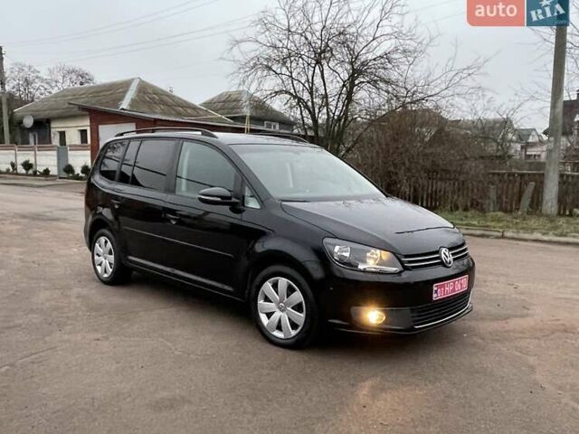 Черный Фольксваген Туран, объемом двигателя 1.4 л и пробегом 207 тыс. км за 10777 $, фото 1 на Automoto.ua
