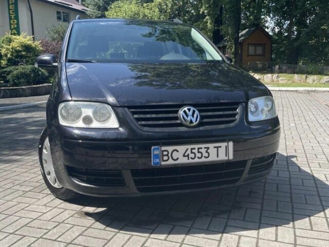 Черный Фольксваген Туран, объемом двигателя 1.6 л и пробегом 256 тыс. км за 4700 $, фото 1 на Automoto.ua
