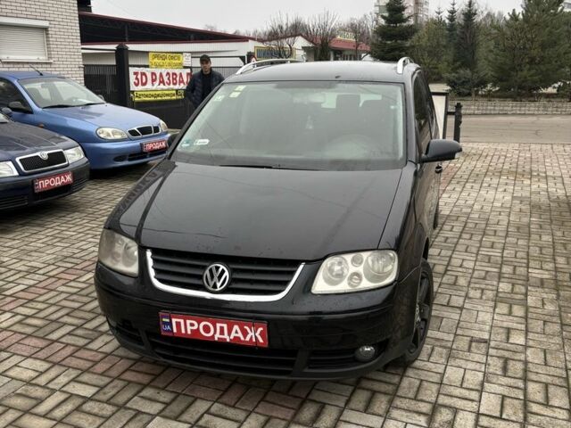 Черный Фольксваген Туран, объемом двигателя 2 л и пробегом 350 тыс. км за 2300 $, фото 1 на Automoto.ua