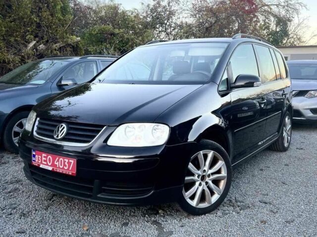 Черный Фольксваген Туран, объемом двигателя 1.6 л и пробегом 281 тыс. км за 5800 $, фото 1 на Automoto.ua