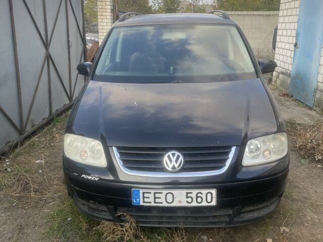 Чорний Фольксваген Туран, об'ємом двигуна 2 л та пробігом 330 тис. км за 2614 $, фото 1 на Automoto.ua