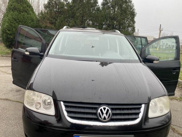 Чорний Фольксваген Туран, об'ємом двигуна 2 л та пробігом 383 тис. км за 3500 $, фото 1 на Automoto.ua