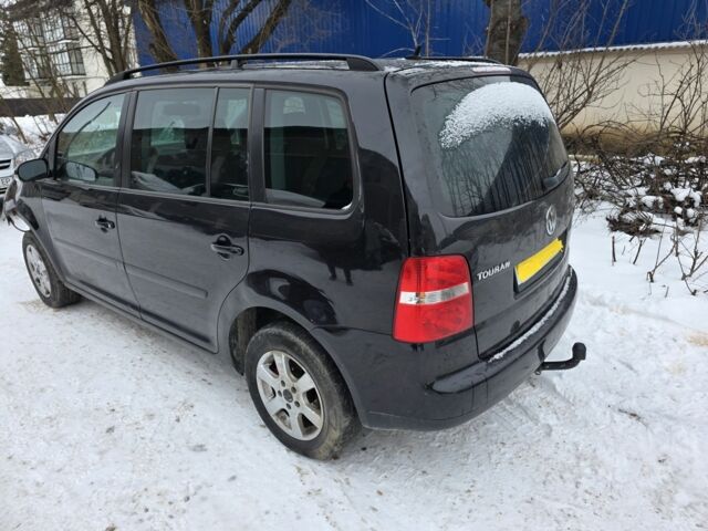 Черный Фольксваген Туран, объемом двигателя 2 л и пробегом 276 тыс. км за 3600 $, фото 1 на Automoto.ua