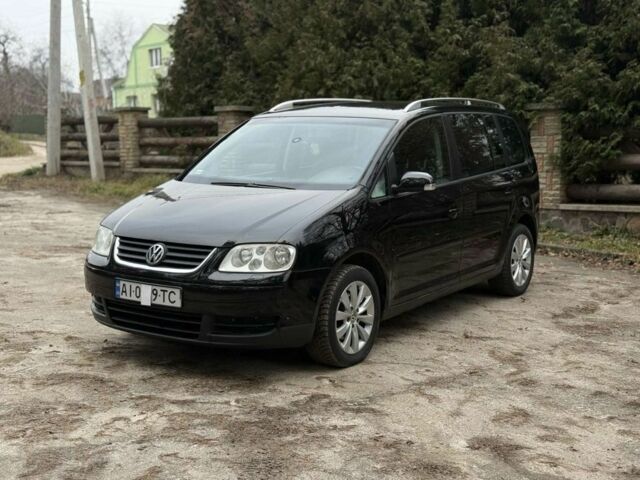 Чорний Фольксваген Туран, об'ємом двигуна 2 л та пробігом 328 тис. км за 2999 $, фото 1 на Automoto.ua