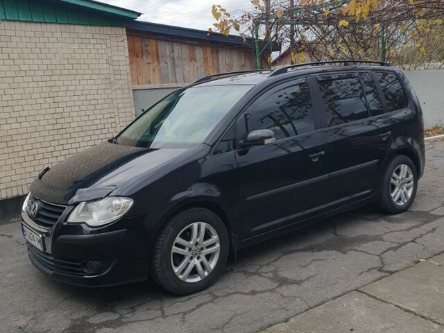 Черный Фольксваген Туран, объемом двигателя 1.9 л и пробегом 242 тыс. км за 8500 $, фото 1 на Automoto.ua