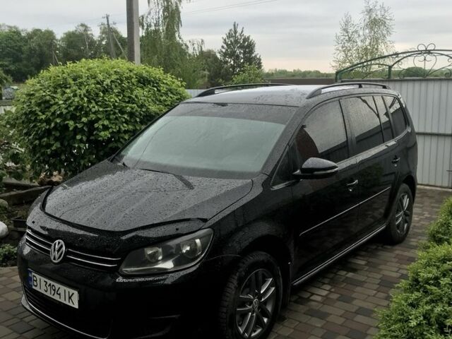Чорний Фольксваген Туран, об'ємом двигуна 1.4 л та пробігом 200 тис. км за 10000 $, фото 1 на Automoto.ua
