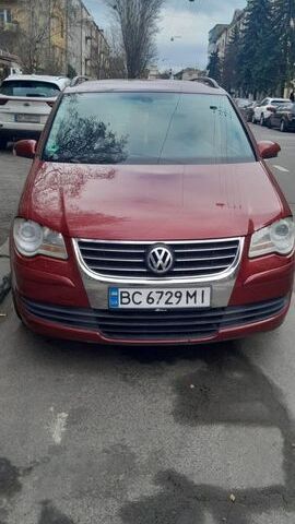 Червоний Фольксваген Туран, об'ємом двигуна 1.97 л та пробігом 320 тис. км за 7400 $, фото 1 на Automoto.ua