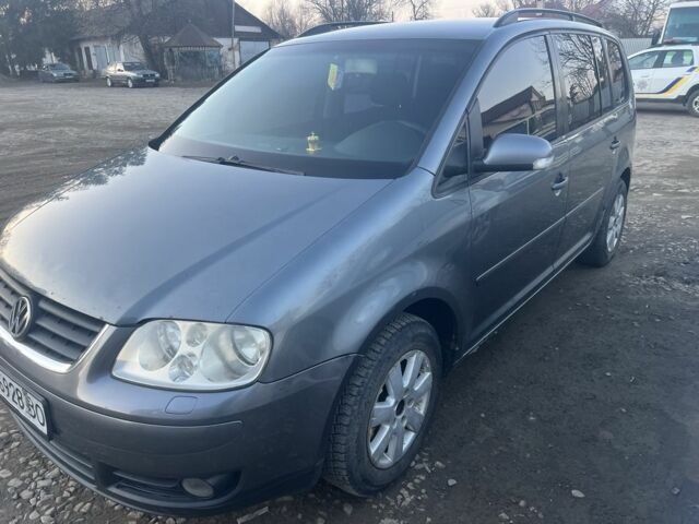 Серый Фольксваген Туран, объемом двигателя 2 л и пробегом 315 тыс. км за 4800 $, фото 1 на Automoto.ua