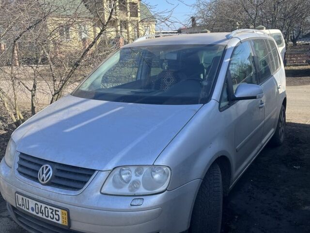 Сірий Фольксваген Туран, об'ємом двигуна 2 л та пробігом 360 тис. км за 4000 $, фото 1 на Automoto.ua