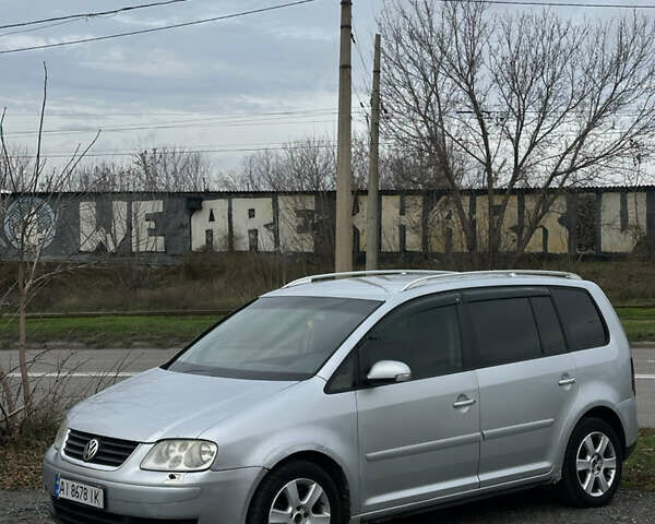 Серый Фольксваген Туран, объемом двигателя 1.97 л и пробегом 281 тыс. км за 4500 $, фото 1 на Automoto.ua