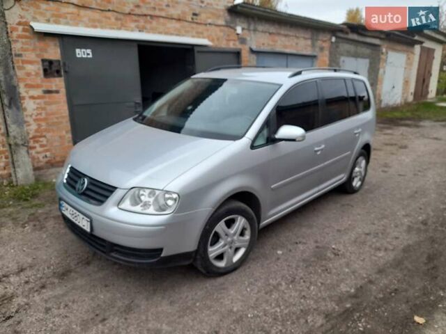 Серый Фольксваген Туран, объемом двигателя 1.39 л и пробегом 212 тыс. км за 5800 $, фото 1 на Automoto.ua