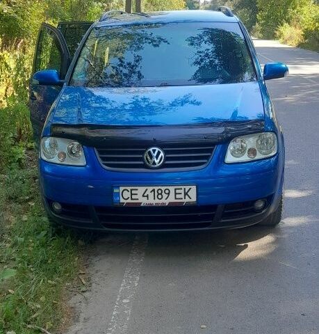 Синий Фольксваген Туран, объемом двигателя 1.6 л и пробегом 214 тыс. км за 5600 $, фото 1 на Automoto.ua