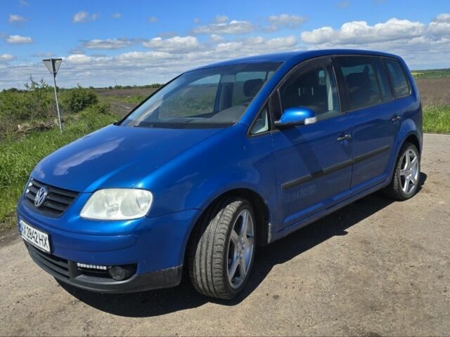 Синий Фольксваген Туран, объемом двигателя 1.6 л и пробегом 312 тыс. км за 5300 $, фото 1 на Automoto.ua