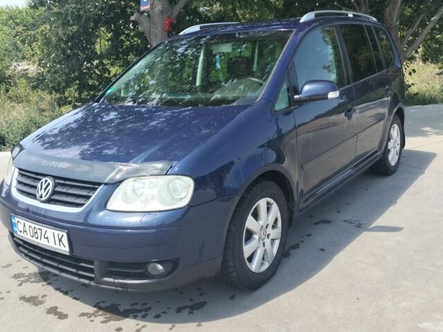Синій Фольксваген Туран, об'ємом двигуна 2 л та пробігом 290 тис. км за 5199 $, фото 1 на Automoto.ua