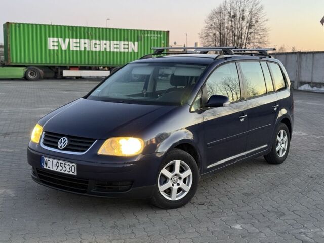 Синий Фольксваген Туран, объемом двигателя 2 л и пробегом 318 тыс. км за 2650 $, фото 1 на Automoto.ua