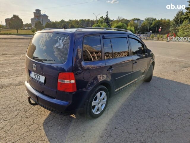 Синий Фольксваген Туран, объемом двигателя 2 л и пробегом 318 тыс. км за 5200 $, фото 1 на Automoto.ua