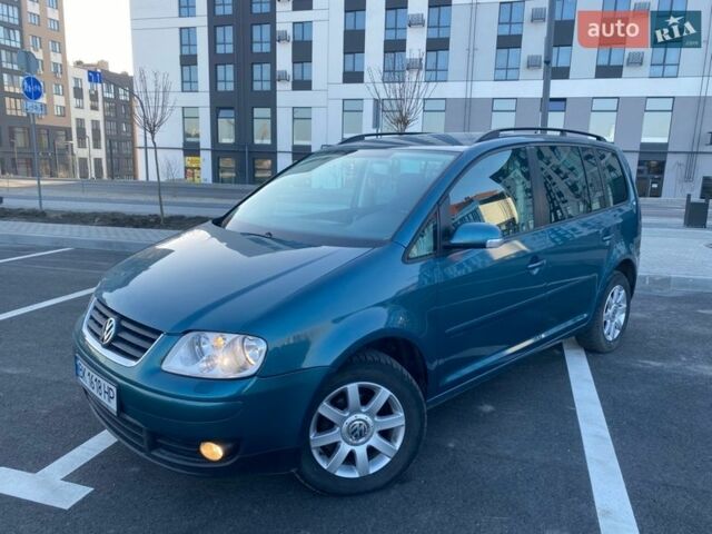 Синий Фольксваген Туран, объемом двигателя 2 л и пробегом 232 тыс. км за 5000 $, фото 1 на Automoto.ua