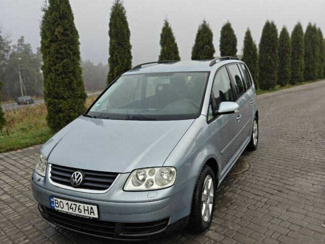 Синий Фольксваген Туран, объемом двигателя 1.6 л и пробегом 205 тыс. км за 5950 $, фото 1 на Automoto.ua