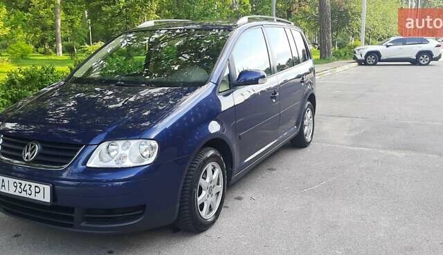 Синий Фольксваген Туран, объемом двигателя 1.4 л и пробегом 261 тыс. км за 6200 $, фото 1 на Automoto.ua