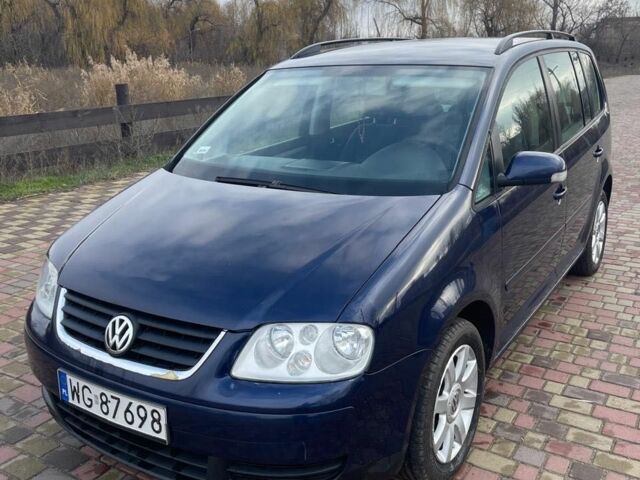 Синий Фольксваген Туран, объемом двигателя 1.9 л и пробегом 322 тыс. км за 3900 $, фото 1 на Automoto.ua