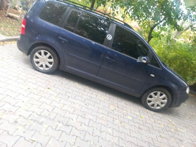 Фольксваген Туран 2005 в Сумах на Automoto.ua Синий Фольксваген Туран, объемом двигателя 1 л и пробегом 250 тыс. км за 6299 $, фото 1 на Automoto.ua