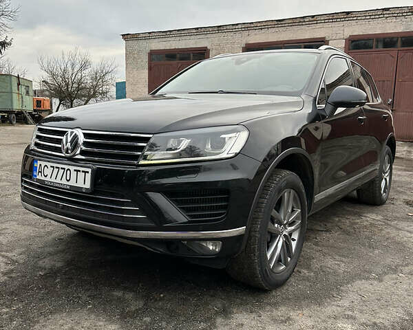 Черный Фольксваген Touareg R, объемом двигателя 3 л и пробегом 193 тыс. км за 32000 $, фото 1 на Automoto.ua