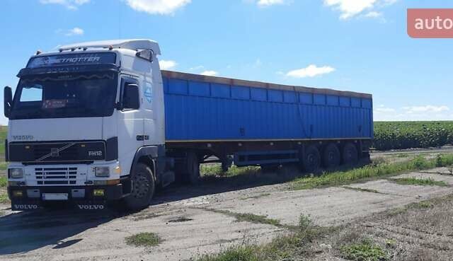 Белый Вольво FH 12, объемом двигателя 12.5 л и пробегом 500 тыс. км за 8000 $, фото 1 на Automoto.ua