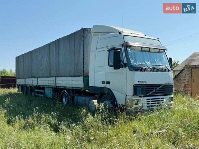 Белый Вольво FH 12, объемом двигателя 12.1 л и пробегом 993 тыс. км за 10500 $, фото 1 на Automoto.ua