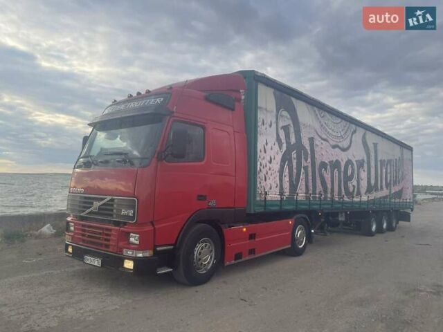 Красный Вольво FH 12, объемом двигателя 12.1 л и пробегом 700 тыс. км за 10500 $, фото 1 на Automoto.ua
