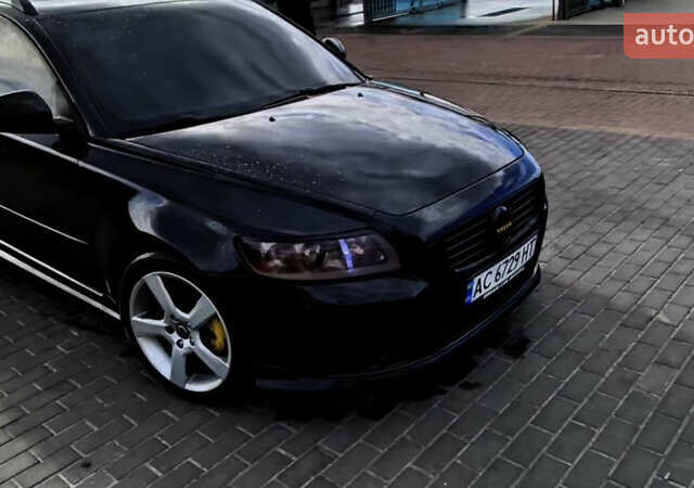 Черный Вольво В50, объемом двигателя 1.56 л и пробегом 292 тыс. км за 7300 $, фото 1 на Automoto.ua