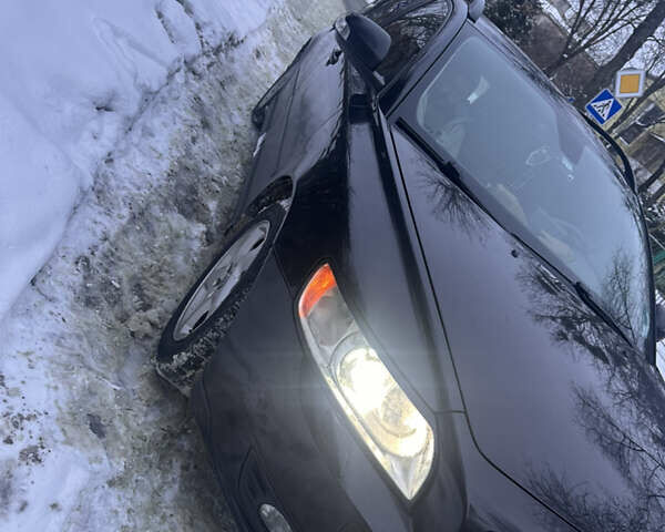 Черный Вольво В50, объемом двигателя 1.6 л и пробегом 257 тыс. км за 7500 $, фото 1 на Automoto.ua