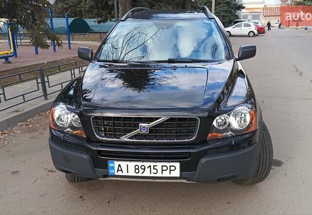 Черный Вольво ХС90, объемом двигателя 2.5 л и пробегом 293 тыс. км за 10800 $, фото 1 на Automoto.ua