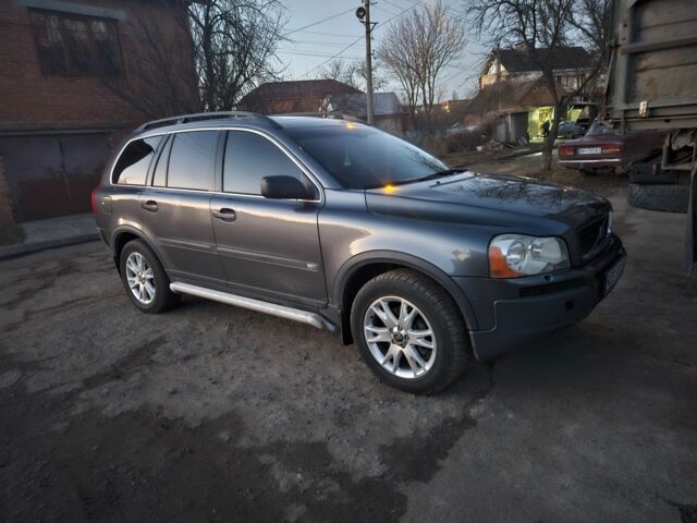 Серый Вольво ХС90, объемом двигателя 2.4 л и пробегом 329 тыс. км за 6500 $, фото 1 на Automoto.ua