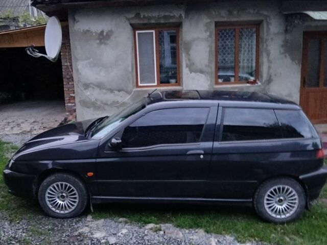 Черный Альфа 145, объемом двигателя 1.4 л и пробегом 300 тыс. км за 1750 $, фото 3 на Automoto.ua