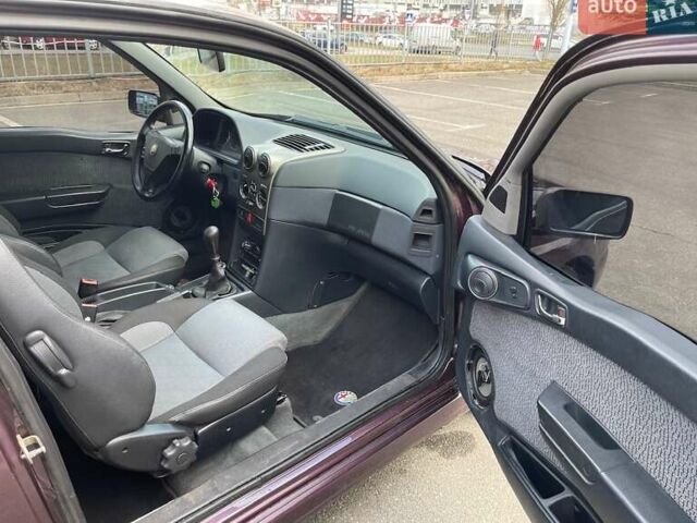 Фіолетовий Альфа Ромео 145, об'ємом двигуна 2 л та пробігом 194 тис. км за 4500 $, фото 33 на Automoto.ua