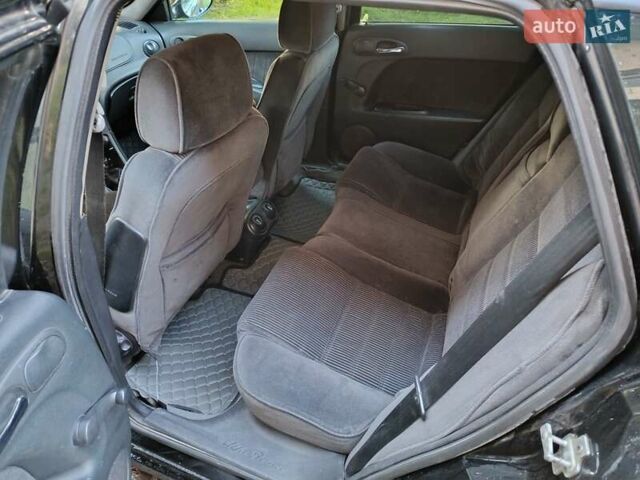 Черный Альфа Ромео 156, объемом двигателя 1.9 л и пробегом 331 тыс. км за 3000 $, фото 2 на Automoto.ua