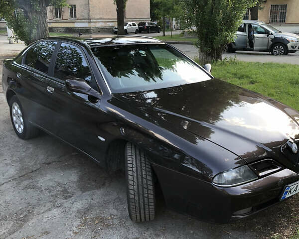 Коричневый Альфа Ромео 166, объемом двигателя 2 л и пробегом 150 тыс. км за 2750 $, фото 5 на Automoto.ua