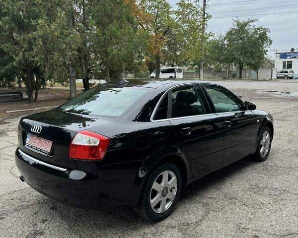 Черный Ауди А4, объемом двигателя 1.6 л и пробегом 198 тыс. км за 6100 $, фото 1 на Automoto.ua