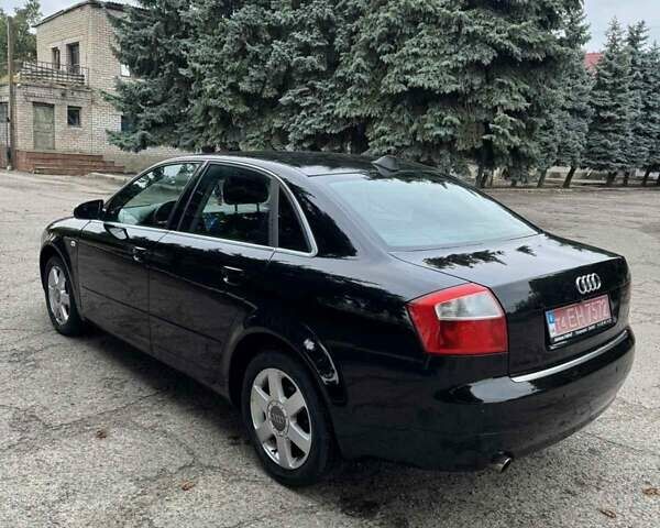 Черный Ауди А4, объемом двигателя 1.6 л и пробегом 198 тыс. км за 6100 $, фото 3 на Automoto.ua
