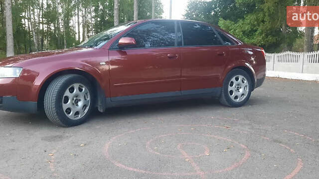 Красный Ауди А4, объемом двигателя 1.6 л и пробегом 300 тыс. км за 4900 $, фото 2 на Automoto.ua