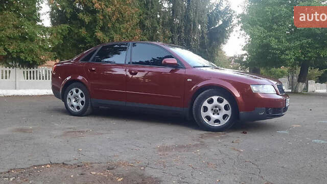 Красный Ауди А4, объемом двигателя 1.6 л и пробегом 300 тыс. км за 4900 $, фото 1 на Automoto.ua